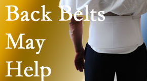Nashua back pain sufferers wearing back support belts are supported and reminded to move carefully while healing.