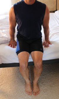use hhands and legs to push up out of bed